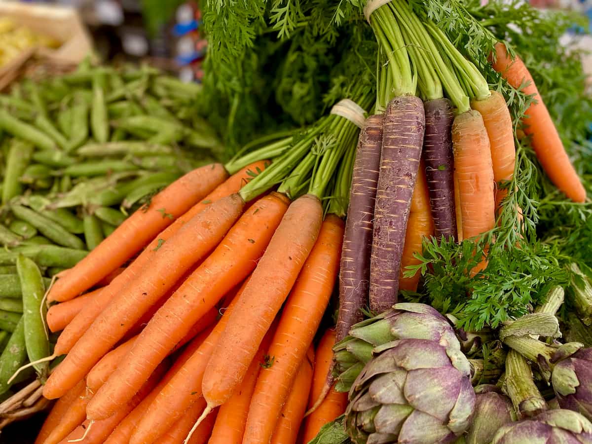 purple and orange carrots at the French market