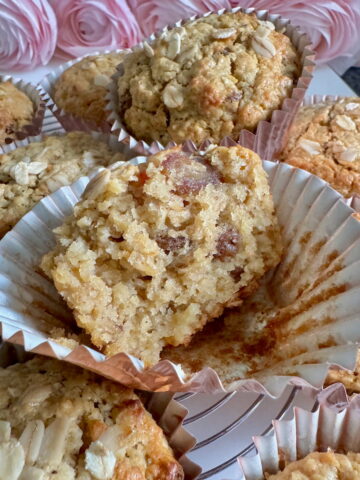halved muffin showing how light and moist they are, made with oat bran, sultana raisins and apple