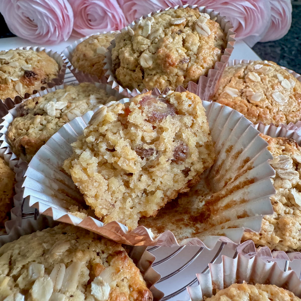 halved muffin showing how light and moist they are, made with oat bran, sultana raisins and apple