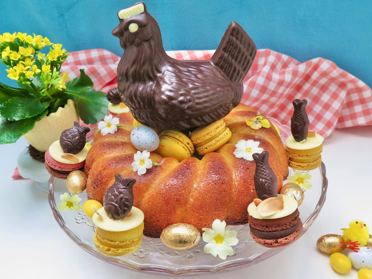 lemon cake shaped like a nest with eggs and chocolate as decorations for Easter