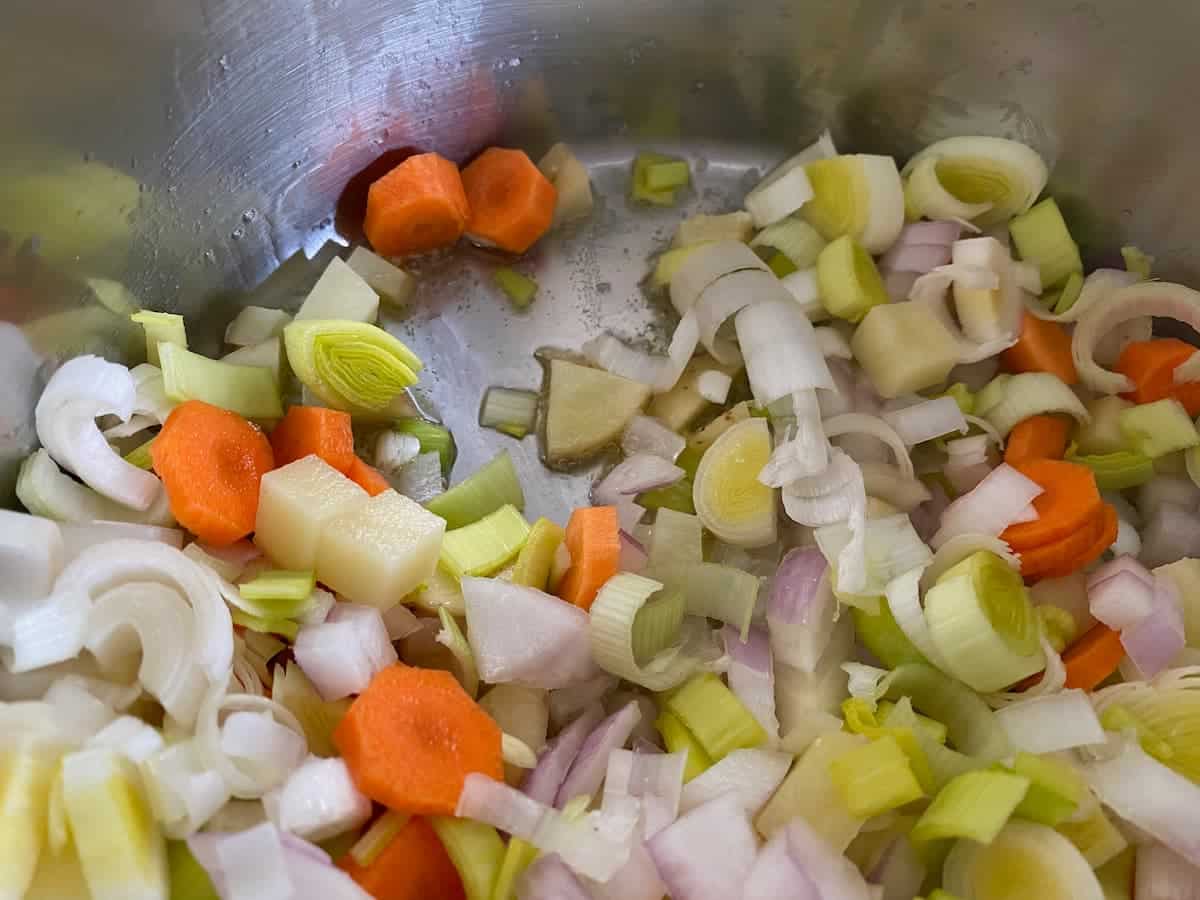 chopped vegetables cooking in butter