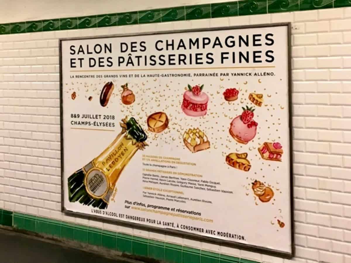 poster of Champagne bottle and French cakes paintings in the Paris metro