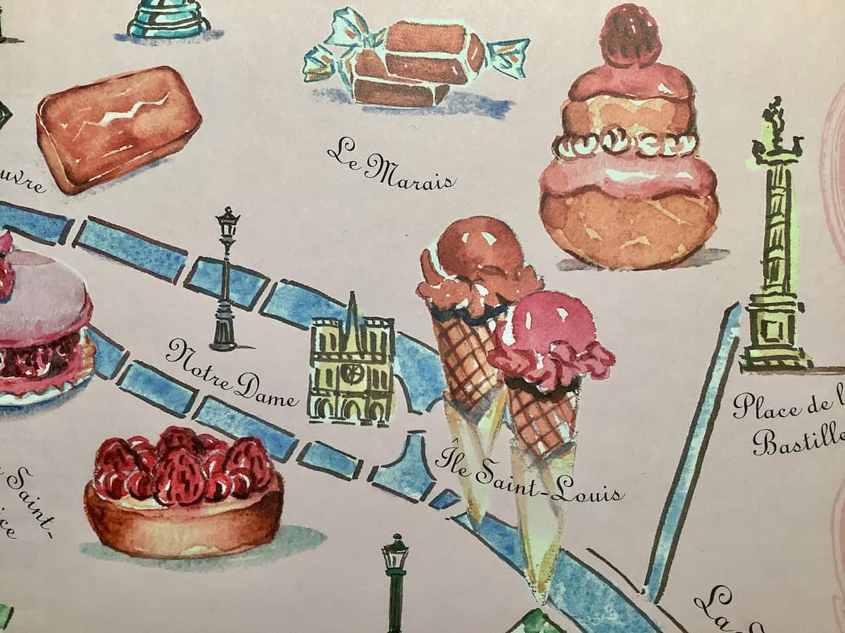 close-up of cakes and ice cream paintings on a map of Paris