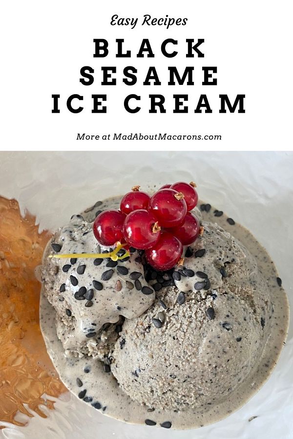 Black sesame ice cream with tuile and redcurrants in bowl