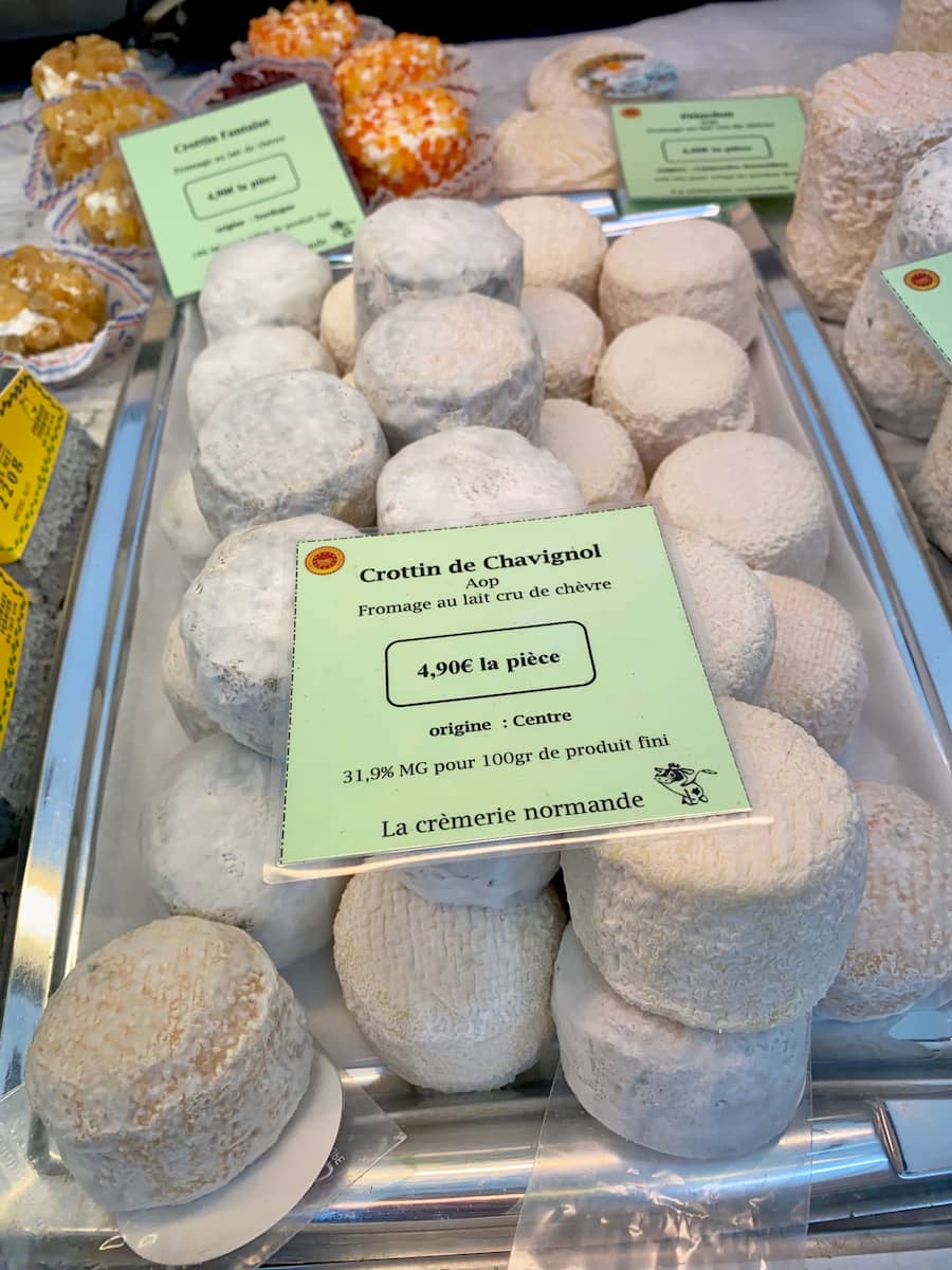 platter of round goat cheeses at the French market