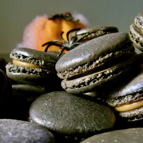 black macarons with spider and cobwebs pumpkin