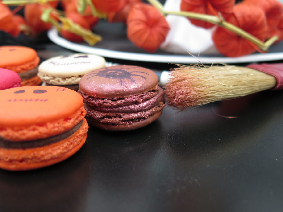 brushing on edible glitter on macarons