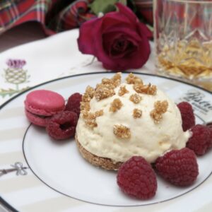 honey parfaits on shortbread with raspberries and a macaron