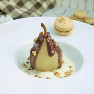 Pear Belle Helene, a poached pear on ice cream topped with chocolate sauce