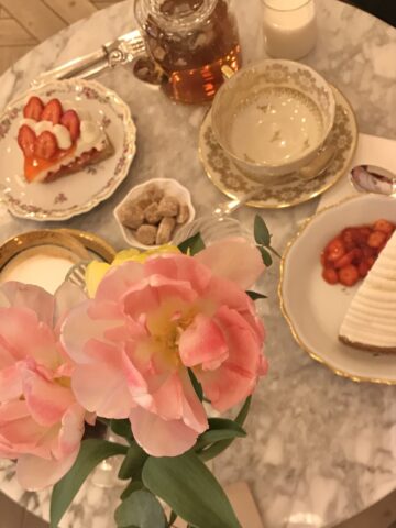 round table with tea and cakes in Paris