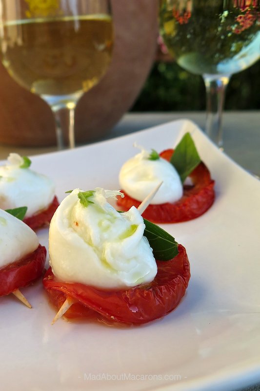 skewered roasted tomato slices with basil, mozzarella and olive oil