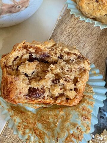 inside of a muffin revealing perfect crumb and lots of moist dried fruits