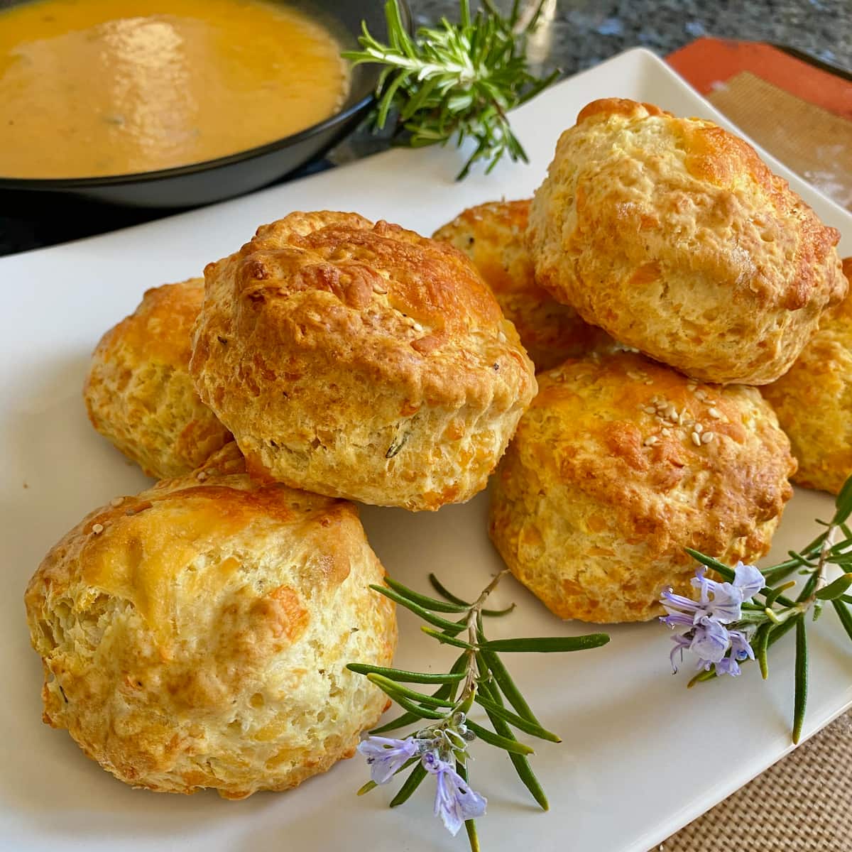 high rise cheesy scones served with a bowl of soup