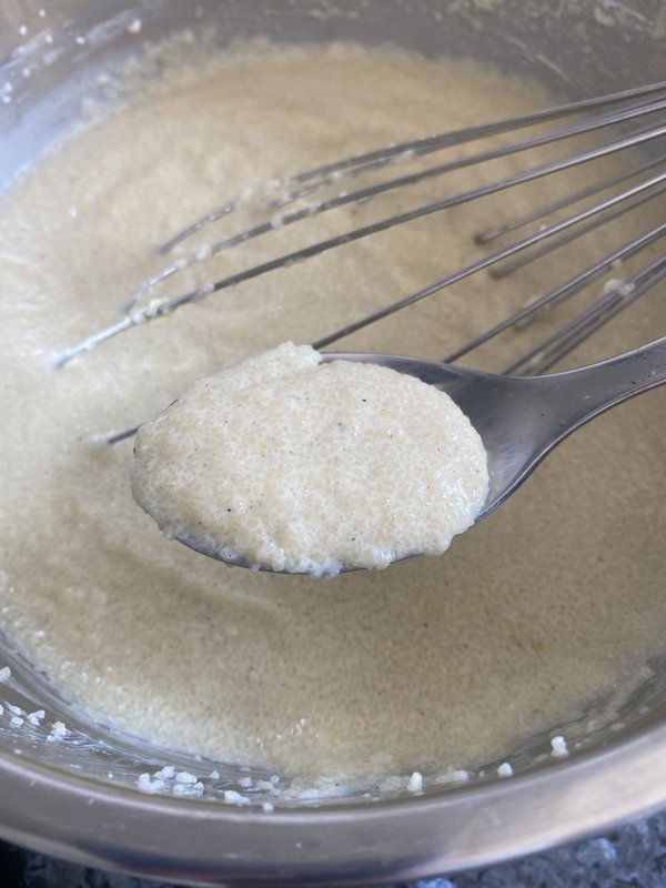 a spoonful of creamy semolina pudding mixture