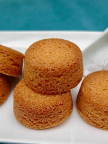 high raised round buttery biscuits with a rough texture with air-holes