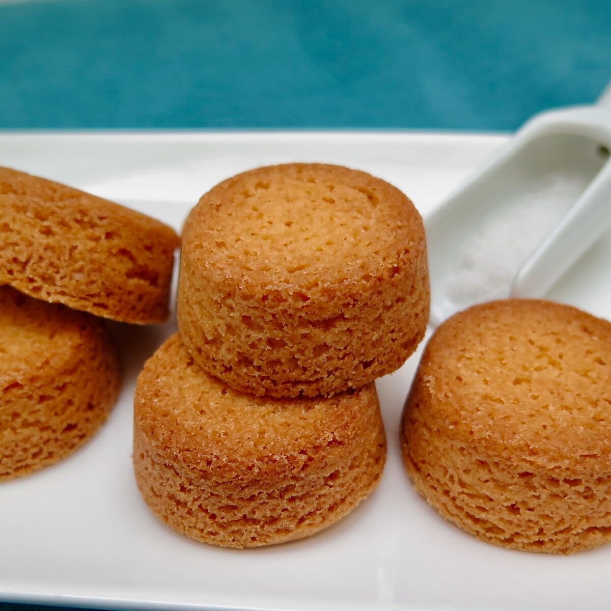 high raised round buttery biscuits with a rough texture with air-holes