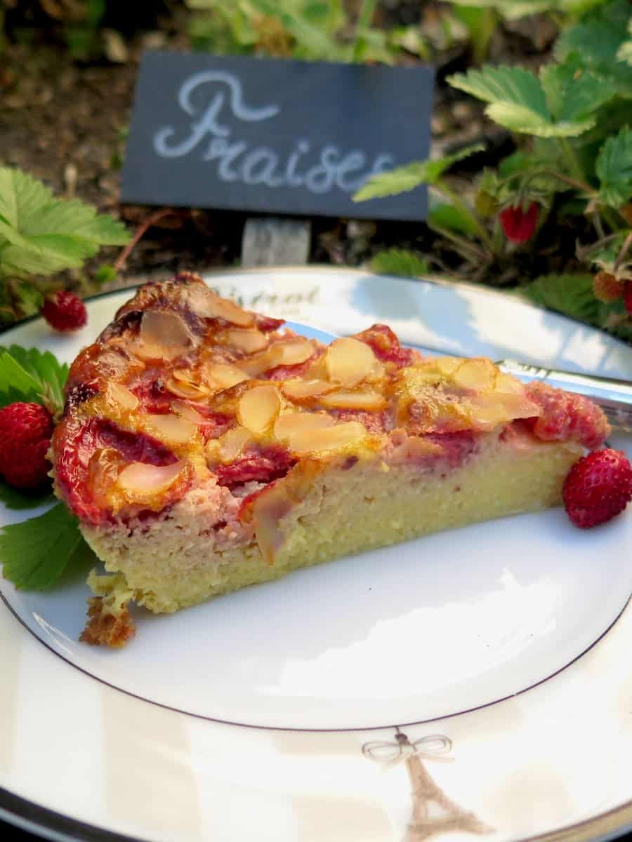 slice of strawberry baked custard dessert with a French sign saying 'Fraises'