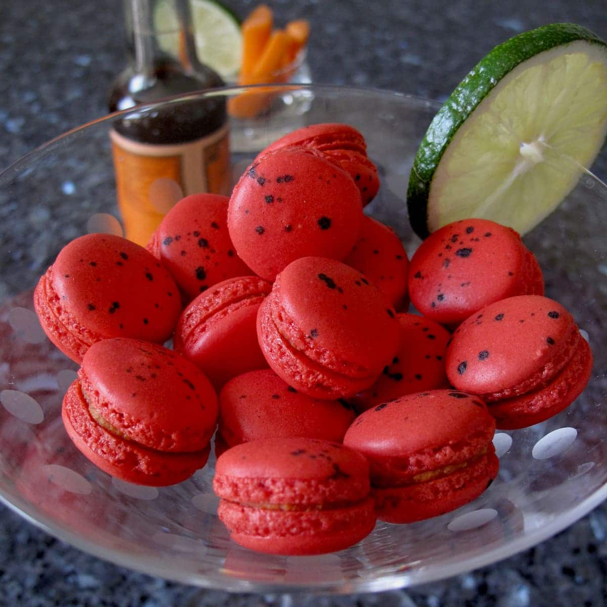 The best Bloody Mary is Mad About Macarons mini red macarons with black dots in a cocktail glass