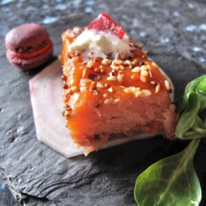 smoked salmon steak with a mini purple macaron