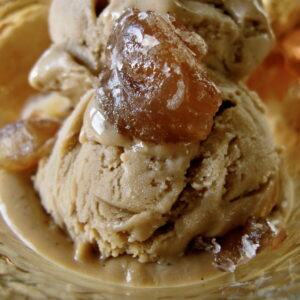 scoop of chestnut ice cream topped with a candied chestnut
