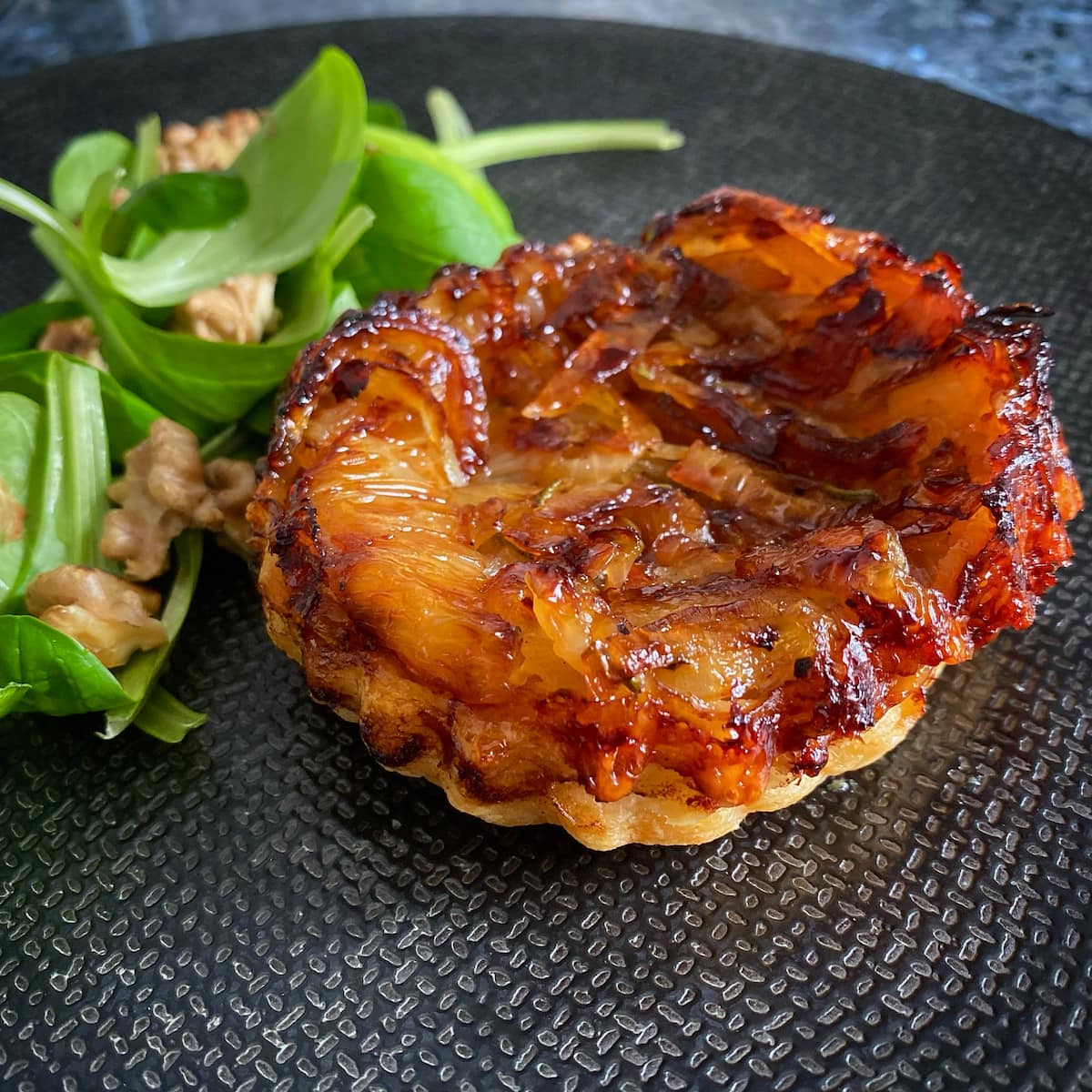 French onion tartlet tatin with salad