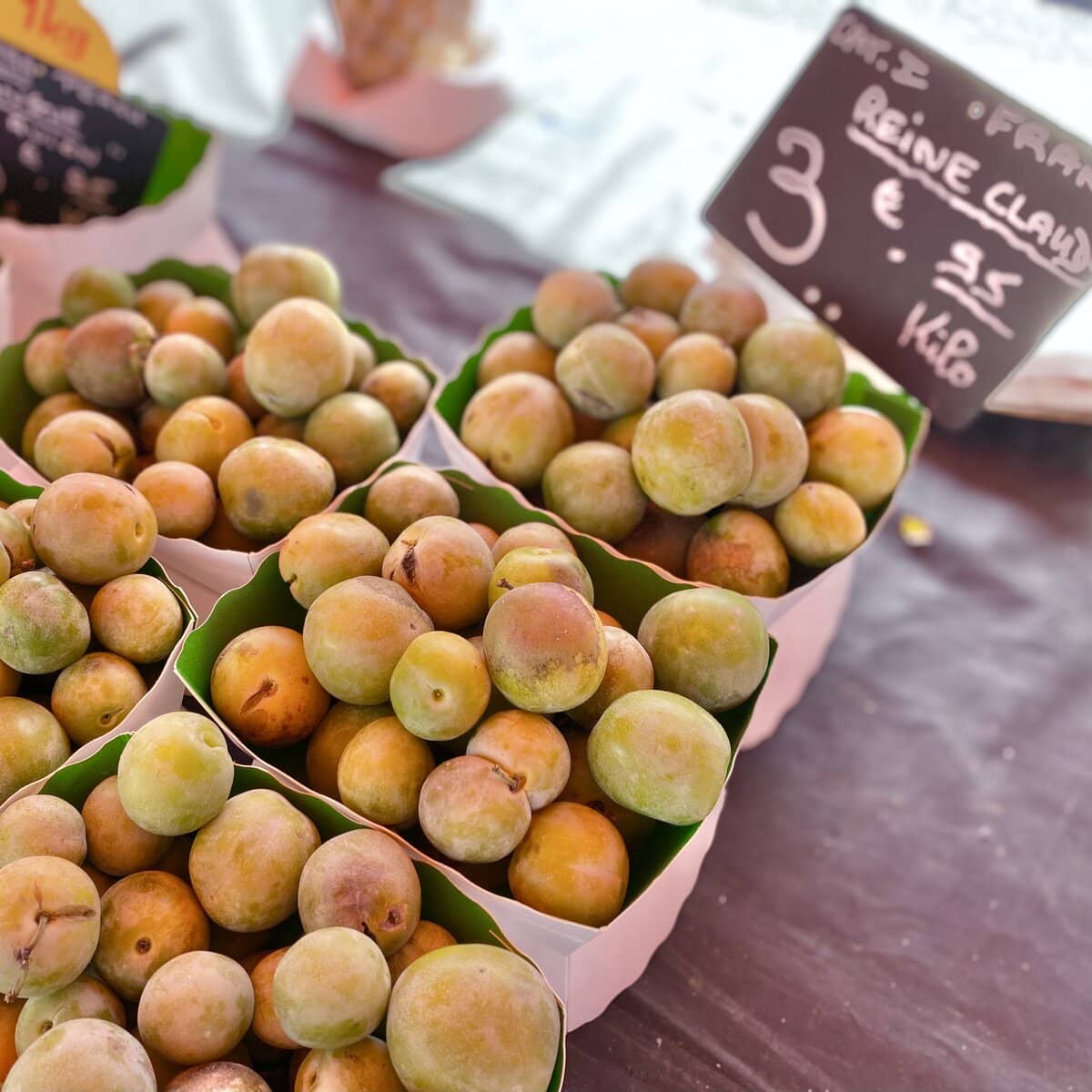boxes of greengages at the french market