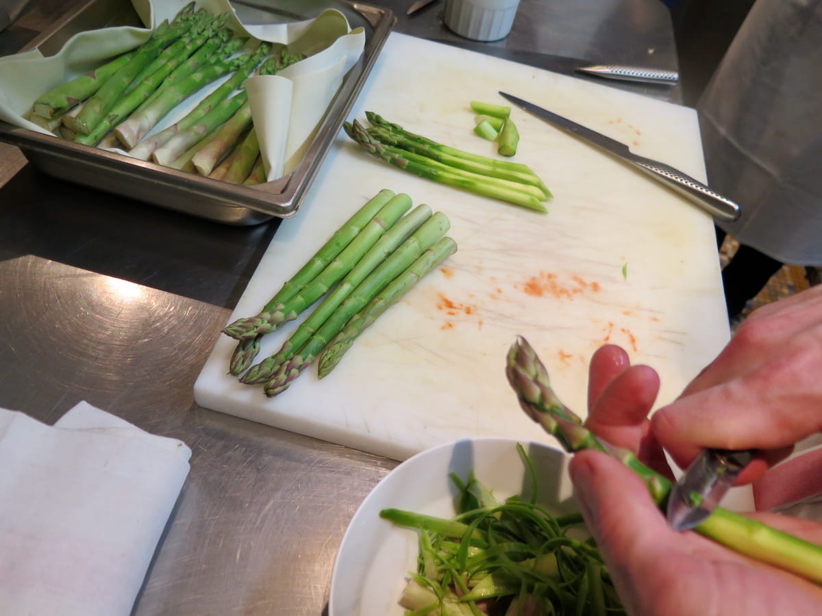 peeling asparagus spears