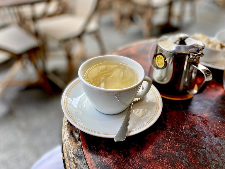 cup of tea and pot in parisian cafe