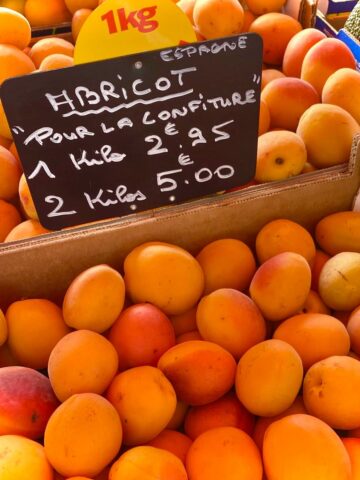 crates of fresh apricots