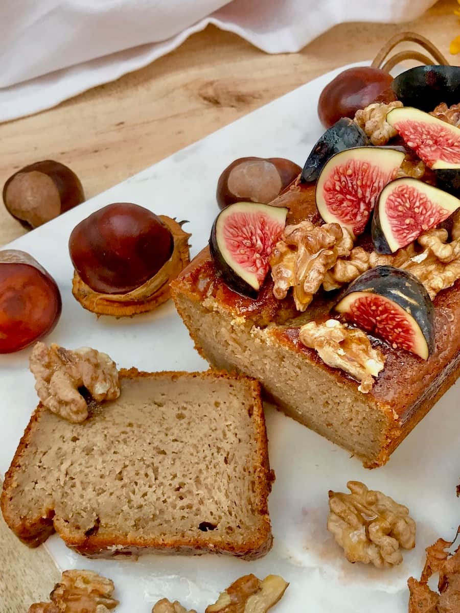 slice of banana nut bread topped with walnuts and figs