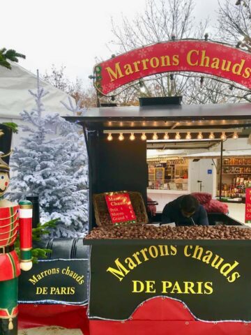 nutcracker soldiers in front of a hot chestnut stand in Paris