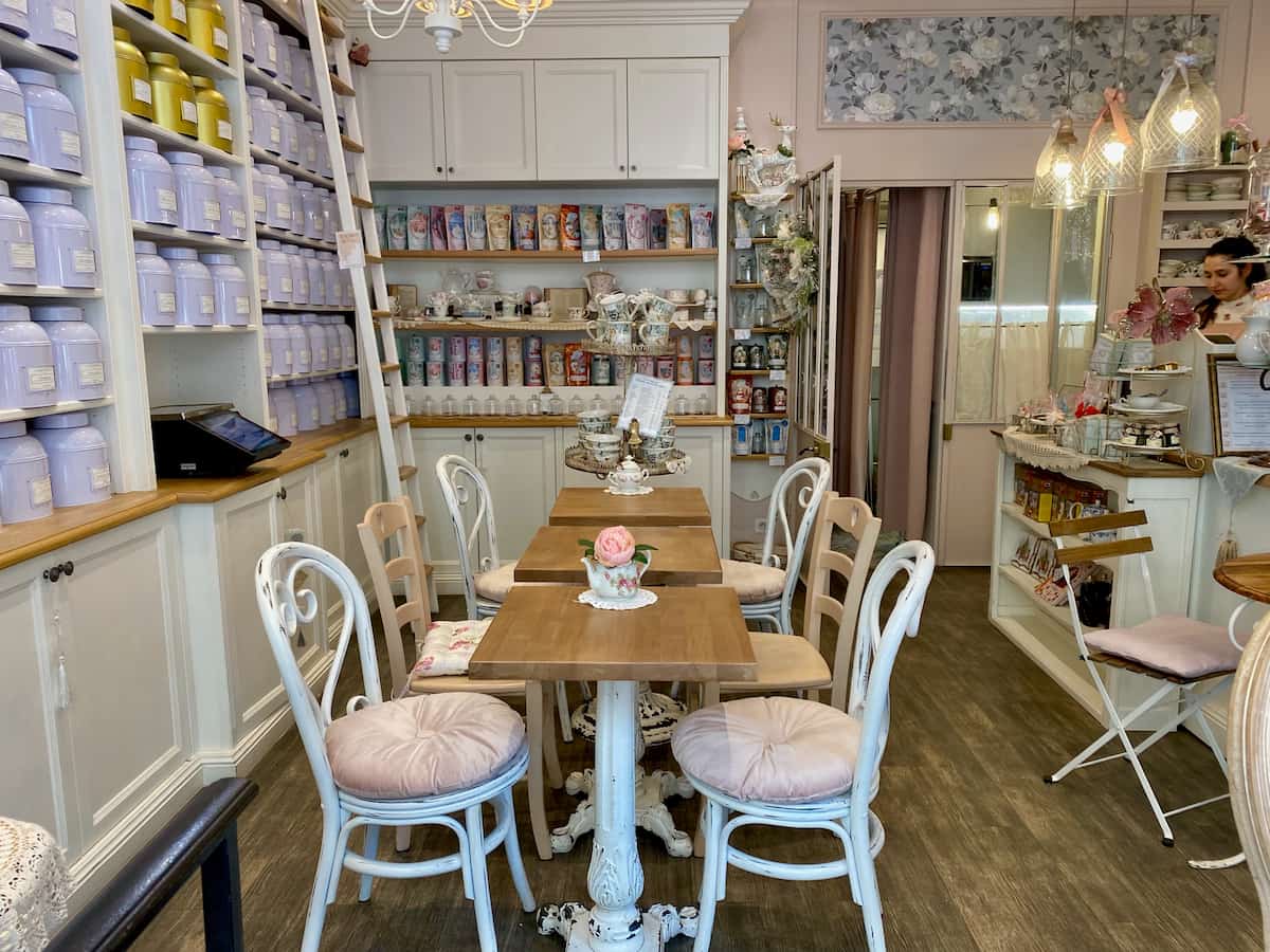 cosy tearoom in Paris amongst pastel tea tins