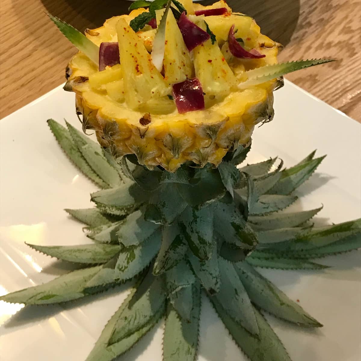 upside down pineapple serving idea with cut pineapple inside