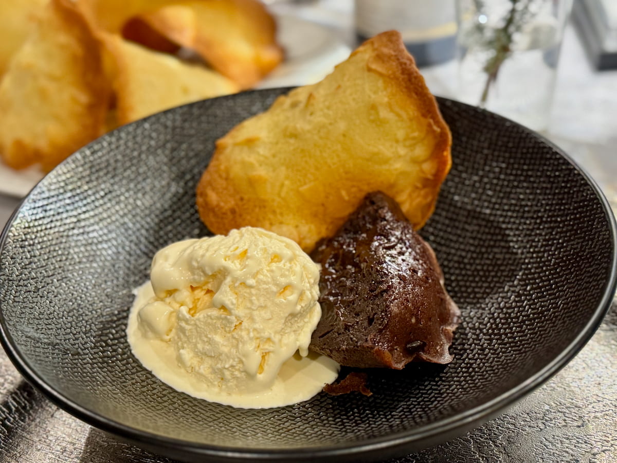 bowl of Whisky ice cream, chocolate lava cake and a crispy tuile cookie