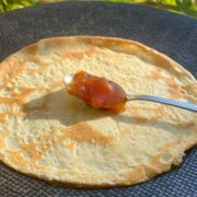 thin pancake with a spoonful of jam