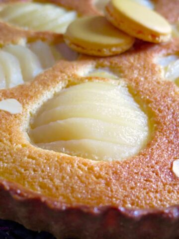 pears sitting in an almond tart