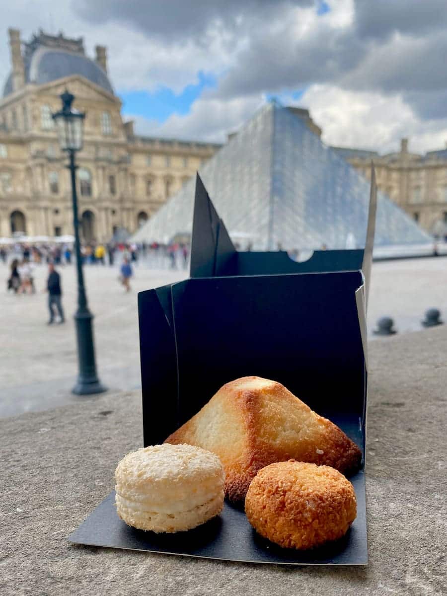 coconut cookies in front of the pyramid in Paris, showing the difference macaroons vs macarons
