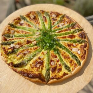 asparagus tart on wooden board in the sun