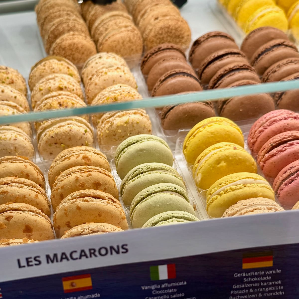 different colours of French macaron flavours at Une Glace à Paris in Montmartre, one of the best in the city
