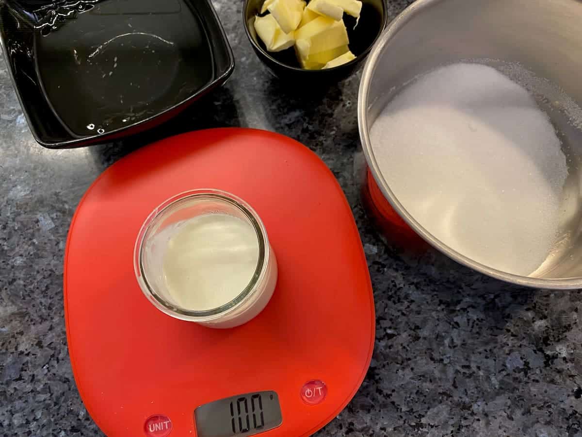weighing out cream, sugar, butter using digital scales
