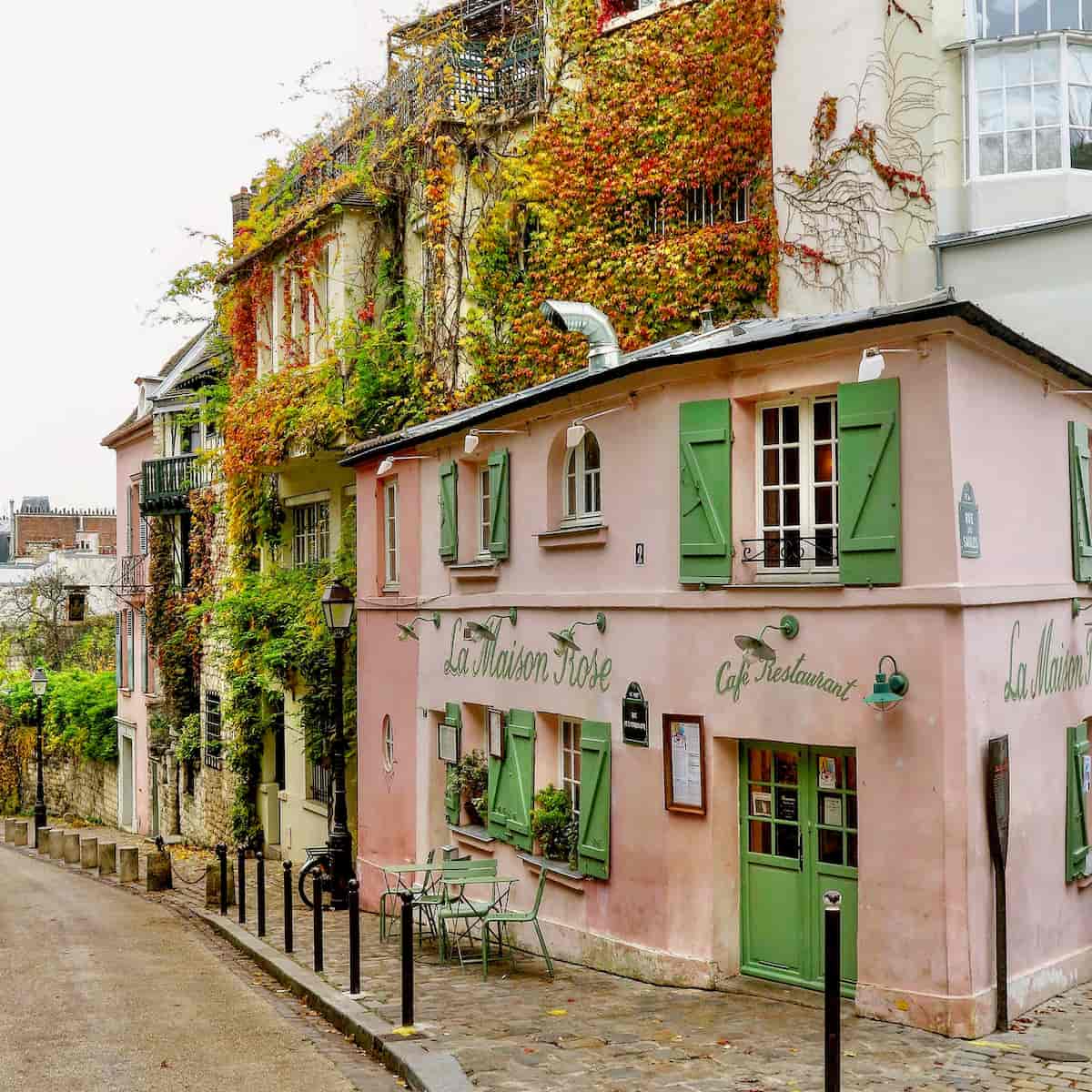 pink restaurant in Paris Montmartre with fall leaves