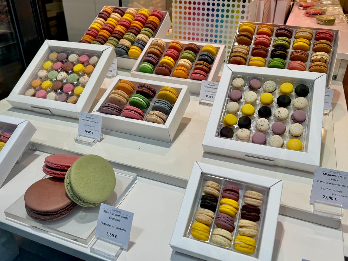 boxes of the smallest mini macarons in a Paris shop window