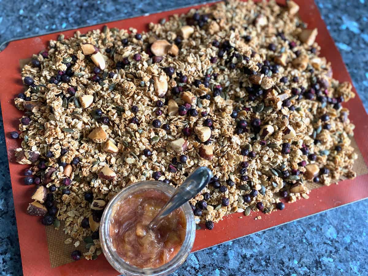 tray of crispy granola with pot of compote