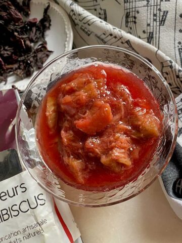 bowl of bright red rhubarb compote