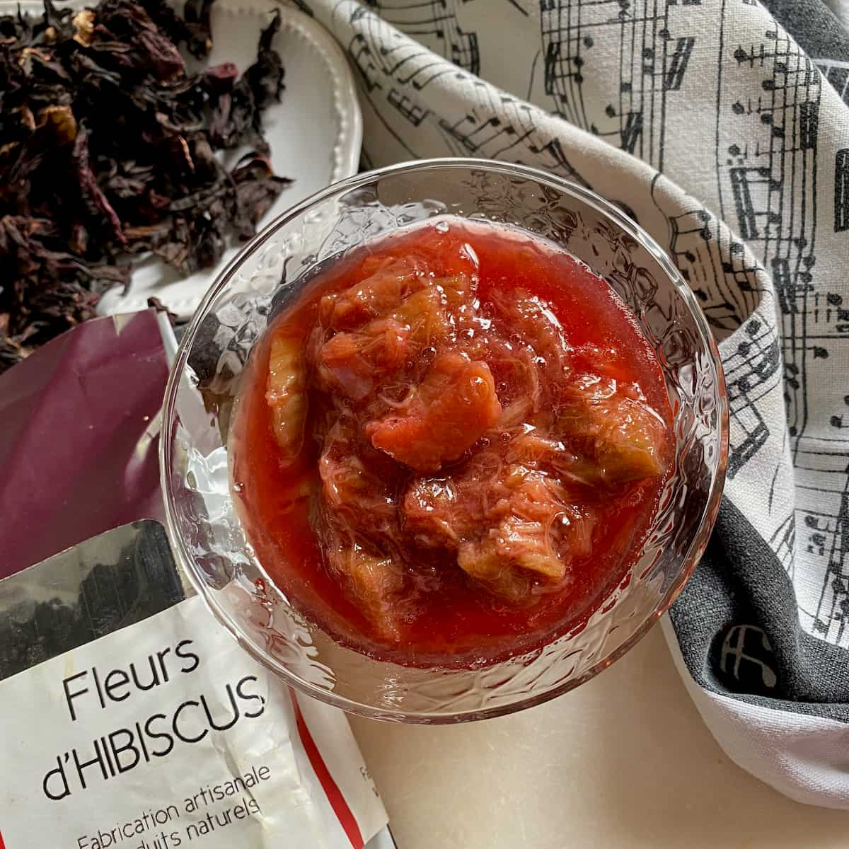 bowl of bright red rhubarb compote