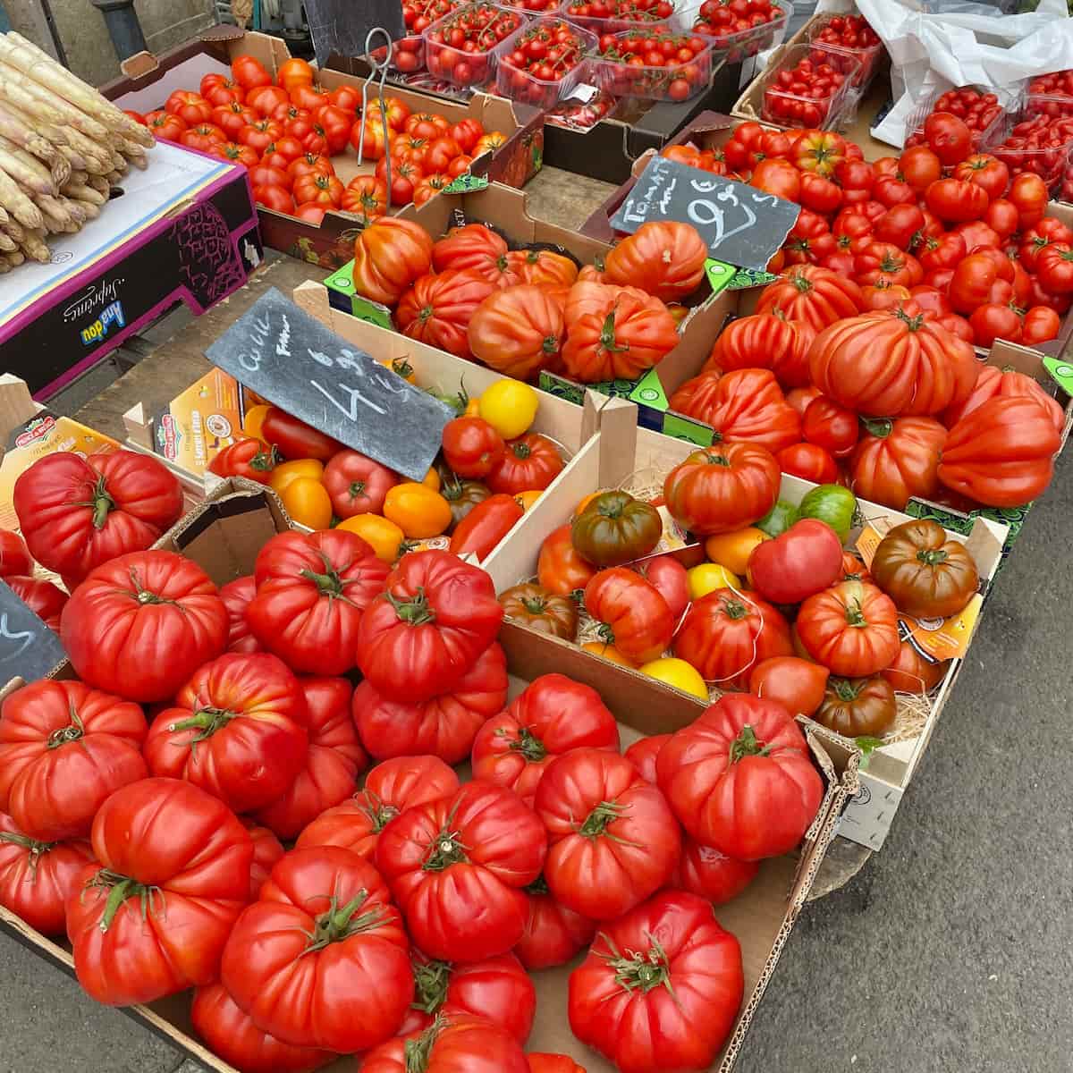 French market stall of fresh red tomatoes