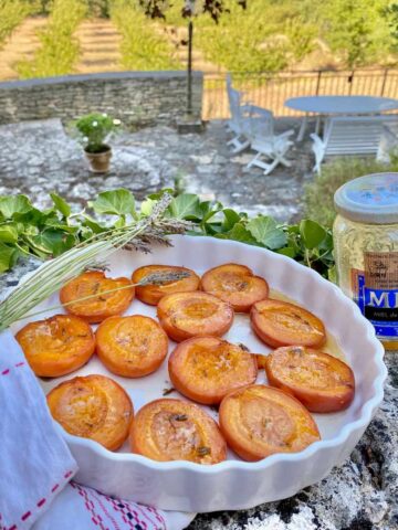 dish of halved apricots baked with lavender and French honey