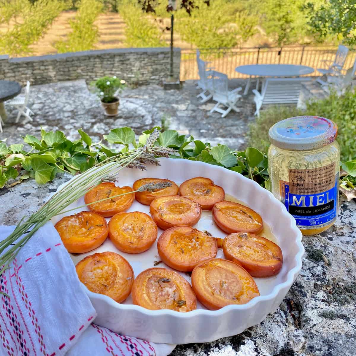 dish of halved apricots baked with lavender and French honey