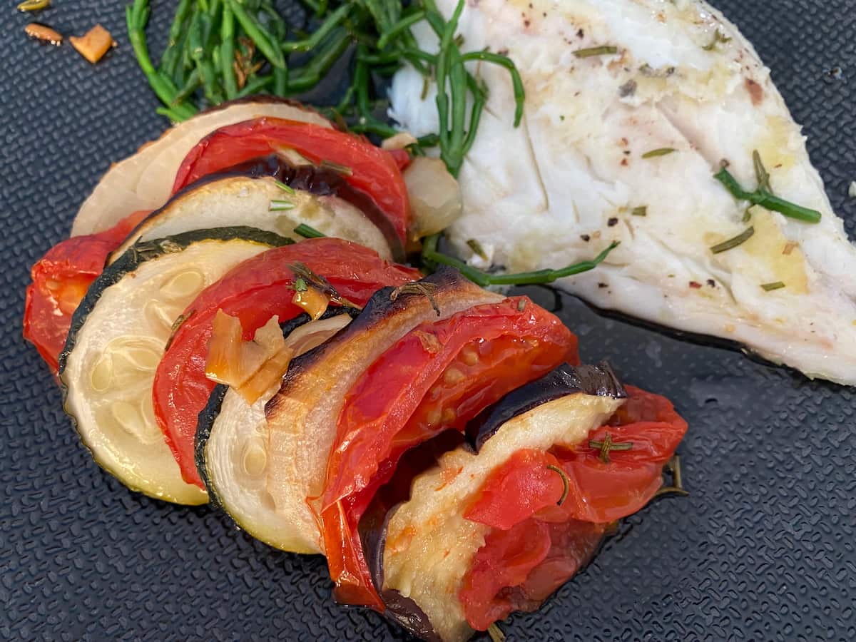 roasted vegetable slices served with fish