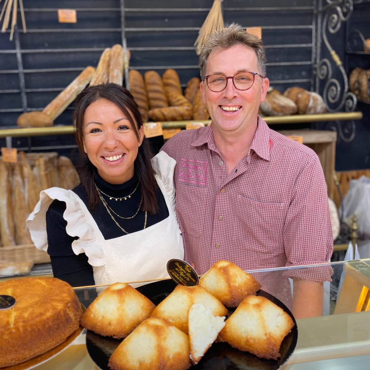 French baker and his wife with pyramid shaped coconut cookies